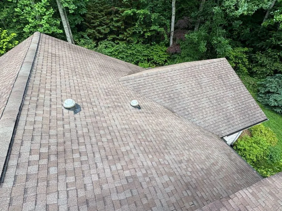 Multiple roof planes cleaned down to the shingle
