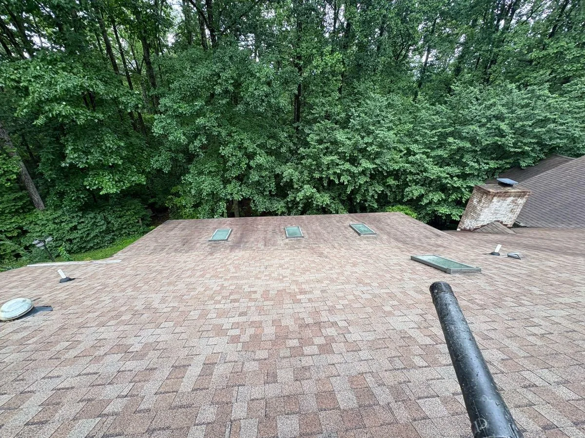 A roof valley and vents cleared of debris