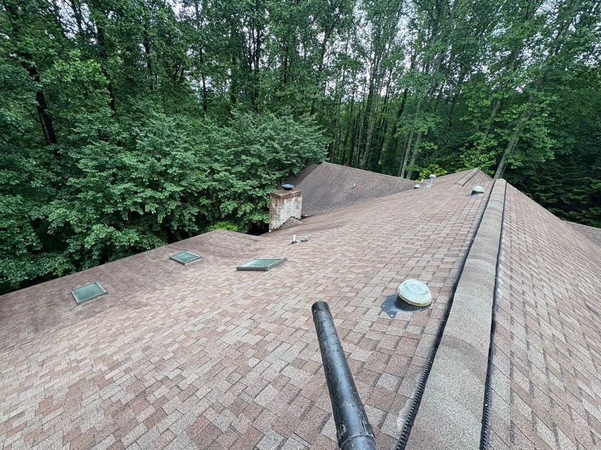 Vents and flashing cleared on a cleaned roof slope